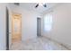 Bright bedroom with elegant marble flooring, a modern ceiling fan, and a well-lit hallway at 22721 N 34Th St, Phoenix, AZ 85050