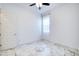 Clean bedroom features white walls, new tile flooring, and a window with sheer curtains at 22721 N 34Th St, Phoenix, AZ 85050