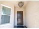 Welcoming entryway with a decorative chandelier and elegant, paneled front door at 22721 N 34Th St, Phoenix, AZ 85050