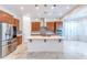 Bright kitchen featuring custom cabinets, stainless steel appliances, and a large central island at 22721 N 34Th St, Phoenix, AZ 85050