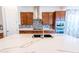 Bright kitchen featuring a central island with a marble countertop and custom cabinetry at 22721 N 34Th St, Phoenix, AZ 85050