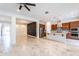 Open-concept kitchen features stainless appliances, large island, and elegant tile floors at 22721 N 34Th St, Phoenix, AZ 85050