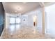Open living room with marble floors, modern lighting, and seamless flow to the kitchen at 22721 N 34Th St, Phoenix, AZ 85050