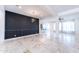 Spacious room with stylish light fixture, accent wall, and tile flooring at 22721 N 34Th St, Phoenix, AZ 85050
