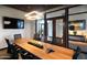 Bright meeting room with a large conference table, TV, and comfortable chairs at 22721 N 34Th St, Phoenix, AZ 85050