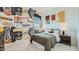 Fun bedroom with basketball-themed wallpaper, a comfortable bed, and stylish decor at 23109 E Nightingale Rd, Queen Creek, AZ 85142