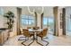 Modern dining room with stylish lighting, a round table with seating, and a view to the outdoor area at 23109 E Nightingale Rd, Queen Creek, AZ 85142