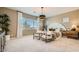 Serene main bedroom featuring a king bed, comfortable seating, and bright natural light at 23109 E Nightingale Rd, Queen Creek, AZ 85142
