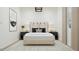 Inviting bedroom featuring plush bedding, minimalist design, and contemporary lighting at 23139 E Lords Way, Queen Creek, AZ 85142