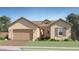 Charming single-story home featuring a low-pitched roof, neutral stucco, and an attached two-car garage at 23139 E Lords Way, Queen Creek, AZ 85142