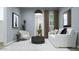 Living room with comfortable furniture, neutral color palette, and large window providing ample natural light at 23139 E Lords Way, Queen Creek, AZ 85142