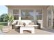Outdoor patio featuring modern furniture, rug, windows, and lighting at 23139 E Lords Way, Queen Creek, AZ 85142