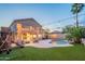 A delightful backyard featuring string lights, a sparkling pool, and cozy seating, creating a warm and inviting outdoor space at 24433 N 75Th St, Scottsdale, AZ 85255