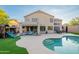 A stunning backyard featuring a covered patio with comfortable seating and an inviting pool for relaxation and entertainment at 24433 N 75Th St, Scottsdale, AZ 85255