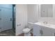 Bathroom with modern vanity, toilet, and glass-enclosed shower with door at 24433 N 75Th St, Scottsdale, AZ 85255