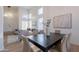 The dining room features an open plan, large windows, and neutral decor, perfect for entertaining at 24433 N 75Th St, Scottsdale, AZ 85255