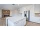 Modern kitchen with white cabinets, stainless steel appliances, and a center island, perfect for culinary creations at 24433 N 75Th St, Scottsdale, AZ 85255