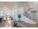 Bright open living room and dining room with soaring ceilings and large windows, creating an open space at 24433 N 75Th St, Scottsdale, AZ 85255