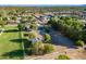 An aerial perspective shows the property's expansive land, pool, and outbuildings at 2724 W Colt Rd, Chandler, AZ 85224