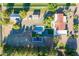 Stunning aerial view of property featuring pool, basketball court, detached buildings, and mature landscaping at 2724 W Colt Rd, Chandler, AZ 85224