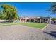 Expansive backyard featuring artificial turf, gravel area, and covered patio for outdoor living at 2724 W Colt Rd, Chandler, AZ 85224