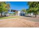 Exterior shot of white barn with dual garage doors and adjacent covered space at 2724 W Colt Rd, Chandler, AZ 85224