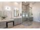 Elegant bathroom featuring glass enclosed shower and gray vanity with modern fixtures and decor at 2724 W Colt Rd, Chandler, AZ 85224