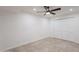 A well-lit bedroom featuring a ceiling fan, tile flooring, and a closet with bi-fold doors at 2724 W Colt Rd, Chandler, AZ 85224