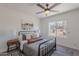 Bright bedroom featuring a ceiling fan, a cozy rug, and ample natural light at 2724 W Colt Rd, Chandler, AZ 85224