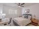 Inviting bedroom with ceiling fan, desk area, natural light, and comfortable furnishings at 2724 W Colt Rd, Chandler, AZ 85224
