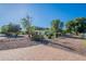 Expansive property featuring mature trees, a circular driveway, and a well-maintained home at 2724 W Colt Rd, Chandler, AZ 85224