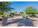 Well-manicured front yard showcasing lush landscaping and a circular driveway leading to the home at 2724 W Colt Rd, Chandler, AZ 85224