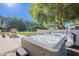 Private hot tub with landscaping, and nearby egg-shaped chairs that offer luxurious backyard relaxation at 2724 W Colt Rd, Chandler, AZ 85224