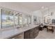 Bright kitchen with a view of the backyard pool and stainless steel appliances at 2724 W Colt Rd, Chandler, AZ 85224