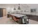 Spacious kitchen island with bar stool seating and modern pendant lighting at 2724 W Colt Rd, Chandler, AZ 85224