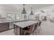Modern kitchen with island, stainless appliances, and a view to the backyard pool at 2724 W Colt Rd, Chandler, AZ 85224