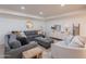 Bright living room with tile floors, recessed lighting, comfortable seating, and stylish decor at 2724 W Colt Rd, Chandler, AZ 85224