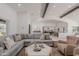 Open-concept living space with wood beam vaulted ceilings and seamless flow into the dining and kitchen areas at 2724 W Colt Rd, Chandler, AZ 85224