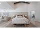 Spacious main bedroom featuring vaulted ceilings, wood accents, and stylish decor at 2724 W Colt Rd, Chandler, AZ 85224