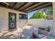 Relaxing covered patio featuring outdoor seating, a TV, and a private outdoor space at 2724 W Colt Rd, Chandler, AZ 85224