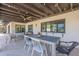 Outdoor patio featuring a dining table, ceiling fan, and recessed lighting for comfortable outdoor living at 2724 W Colt Rd, Chandler, AZ 85224