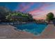 Resort-style pool with water feature and pergola, offering a luxurious outdoor experience for relaxation and enjoyment at 2724 W Colt Rd, Chandler, AZ 85224