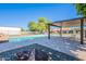Backyard pool with pergola, mature trees, and manicured landscaping at 2724 W Colt Rd, Chandler, AZ 85224