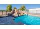 Pool featuring a rock waterfall and slide, perfect for a luxurious outdoor experience at 2724 W Colt Rd, Chandler, AZ 85224