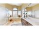 Bathroom featuring a soaking tub, walk-in shower, and double sinks at 2845 E Calavar Rd, Phoenix, AZ 85032