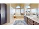 Bright bathroom features a soaking tub, walk-in shower, and double vanity at 2845 E Calavar Rd, Phoenix, AZ 85032