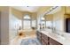 Bathroom featuring a soaking tub, walk-in shower, and double sinks at 2845 E Calavar Rd, Phoenix, AZ 85032