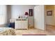 Bedroom featuring neutral tones, dresser, and artwork at 2845 E Calavar Rd, Phoenix, AZ 85032