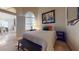 This bedroom has comfortable sleeping arrangements, lots of light, and a great artistic piece at 2845 E Calavar Rd, Phoenix, AZ 85032