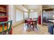 Bright dining area features a cozy table, stainless steel refrigerator and lots of natural light at 2845 E Calavar Rd, Phoenix, AZ 85032